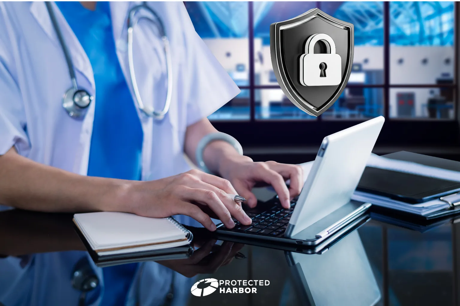Protecting patient data: the imaging shows a doctor working at a laptop with a cybersecurity shield